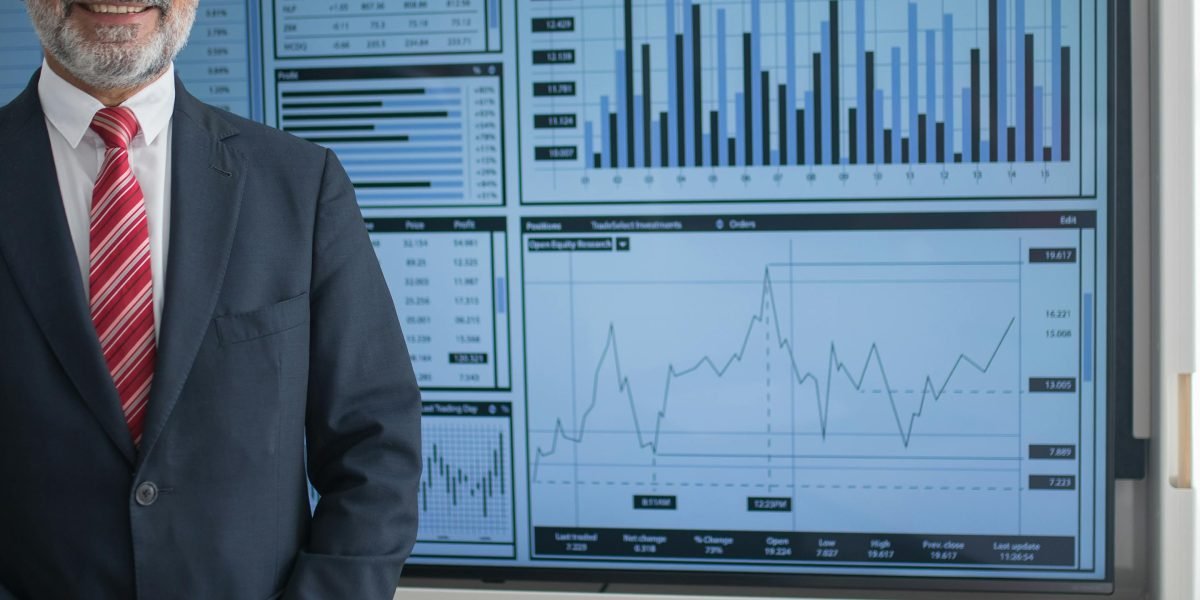 A professional effectively presenting complex data visualizations to an audience, conveying clear market insights.