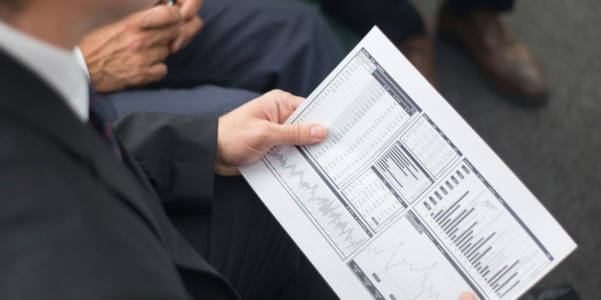 A professional meticulously reviewing data, emphasizing the critical need for accuracy and cleanliness in real estate analytics.