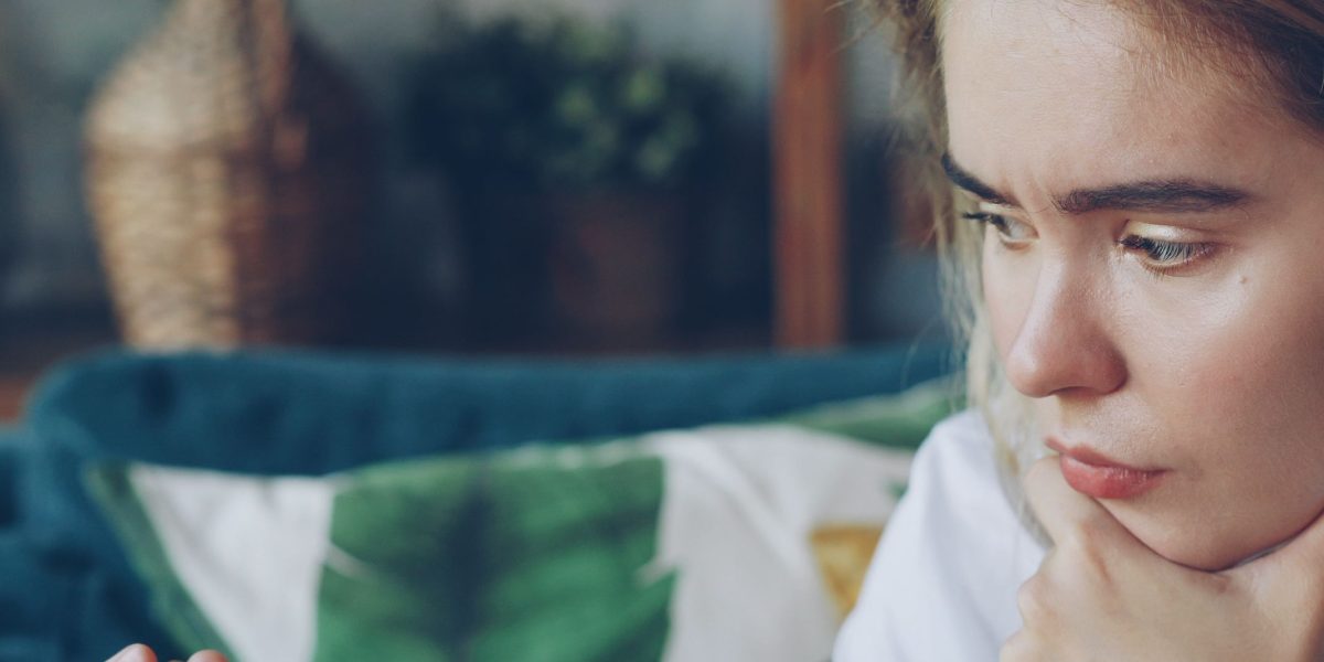 A person focused, making an important decision based on financial strategy.