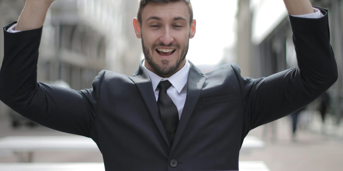 The moment of triumph after successfully earning a certification and securing a desired job opportunity.