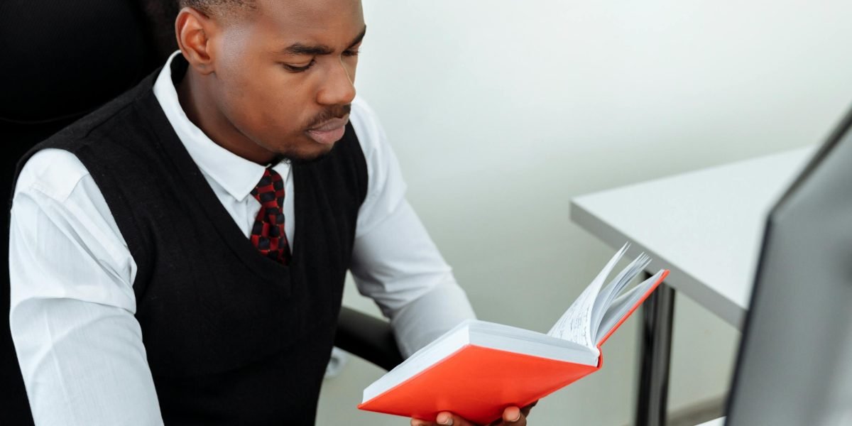 A person diligently studies, representing career development and acquiring new skills in data analytics.