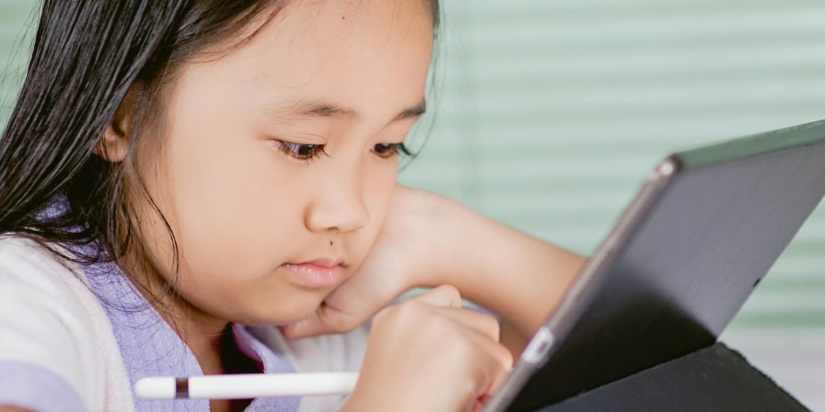 A person focused on an online course, highlighting the accessibility and importance of modern data analytics education.