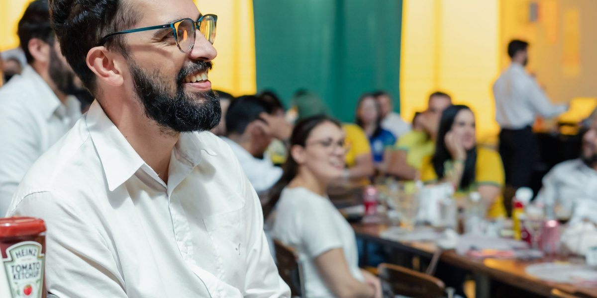 Professionals engaging in conversation at a networking event, making valuable industry connections in the real estate sector.