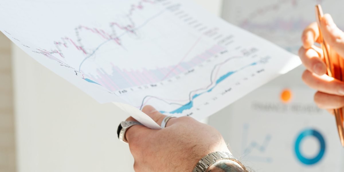 An individual presents complex data insights visually, simplifying information for an audience and fostering clear communication.