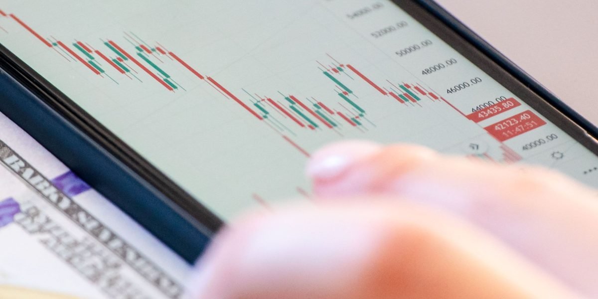 A professional intently studying market trends, representing the deep insights gained through data analytics in real estate.