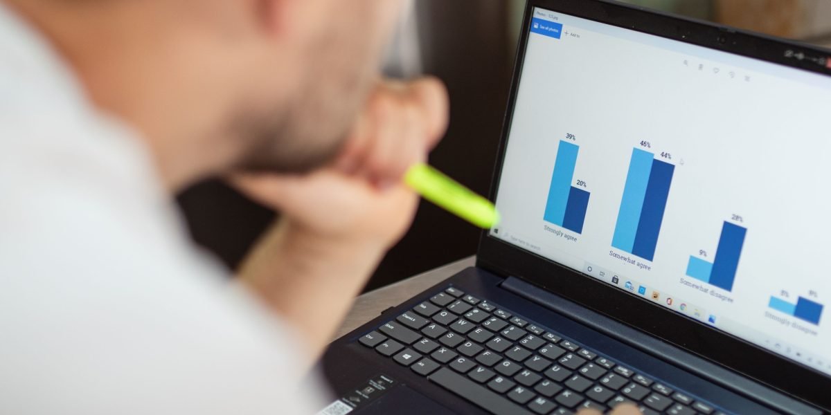 A person thoughtfully analyzing data, representing the critical need for data analytics in fast-moving markets.