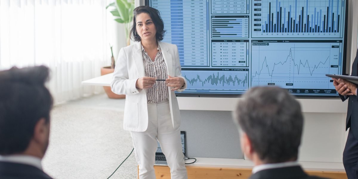 A professional presenting data analysis findings to a team, emphasizing the importance of clear communication.